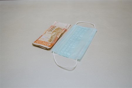 Surgical mask with money