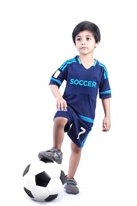 Kid with a soccer ball on white background