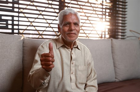 old man giving a thumbs up
