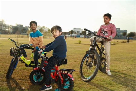 Kids on bicycle in playground