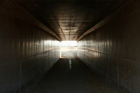 light coming from the end of empty tunnel