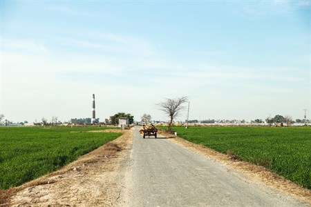 country side road with fields on sides