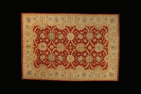 Red and cream patterned rug