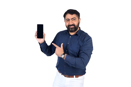 Middle aged man holding a mobile phone and pointing on screen