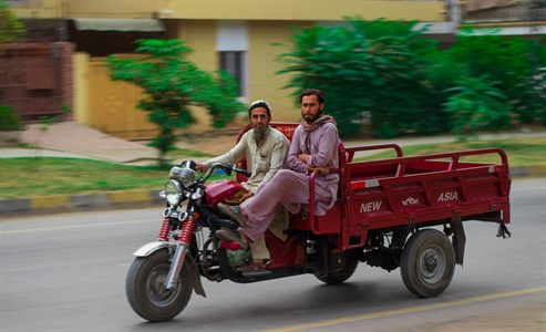 two people on motorcycle rikshaw