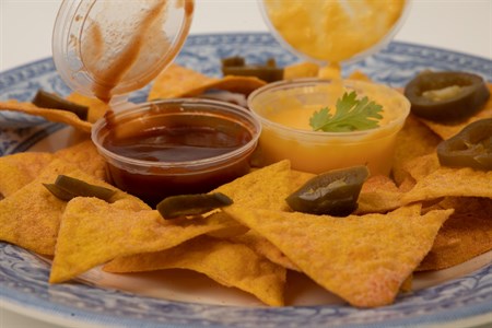 Nachos with dip sauces 