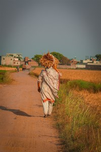 Woman going in village