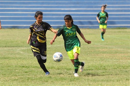 Girls playing football