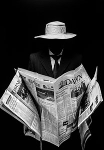 Gentleman with newspaper in hands