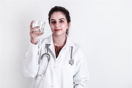  Female Medical Student - Lady Doctor with water glass