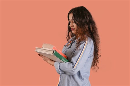 Female Student with Books studying