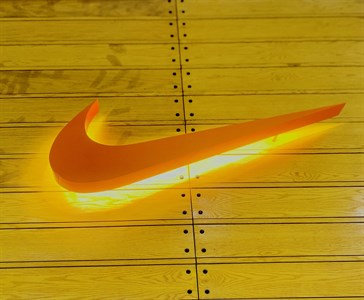 Nike Logo with wooden Background 